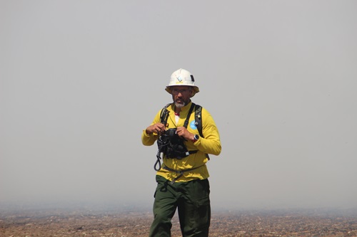 You got to burn, to learn: CSIRO Vesta Mk 2 project leader Dr Miguel Cruz stands in the middle of a field after a successful high intensity experimental fire, Central Victoria.