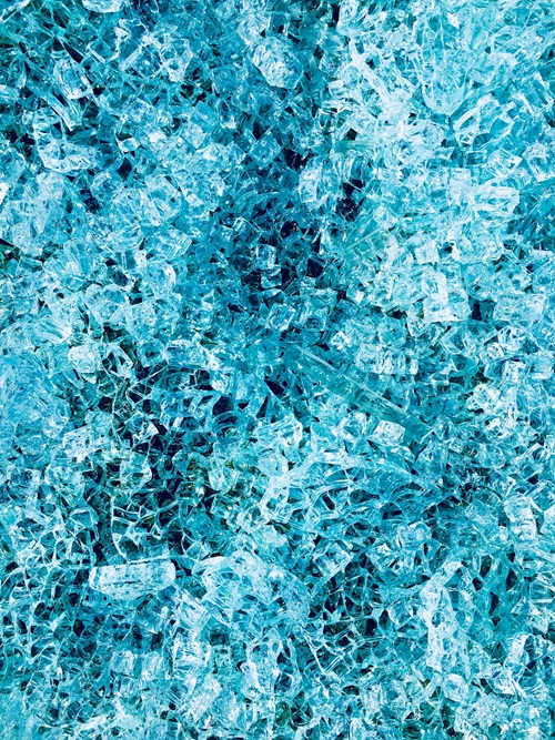 Close up of coloured glass chips ready for recycling.