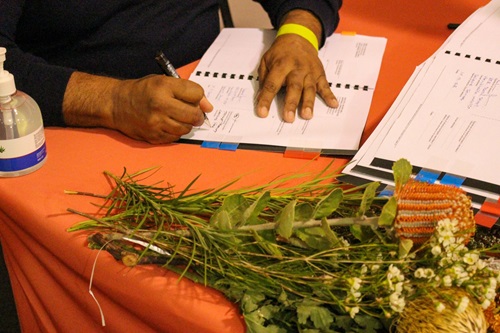 Russell Simpson, Chair WWBL, signing ILUA