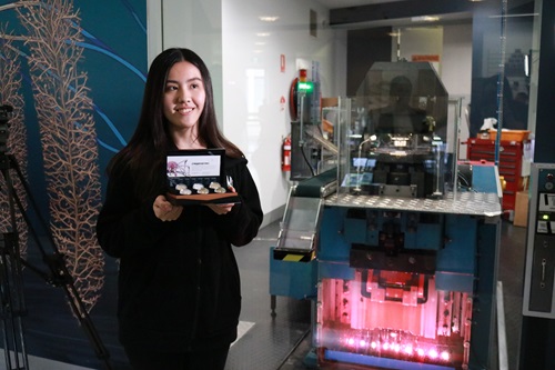 Mina Hsu with the first coin of the 2023 new coin collection 