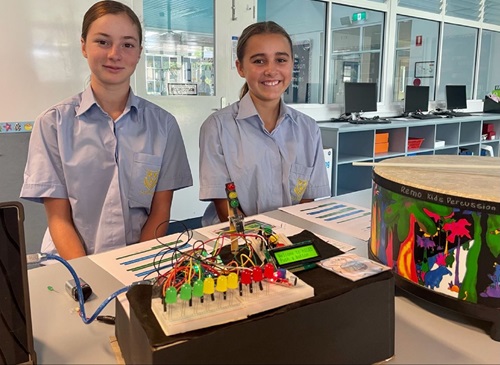 Miette Egerton-Warburton and Elizabeth Townsley from St Hilda's Anglican School for Girls with "Hi LED" – a music teaching aid for the hearing-impaired