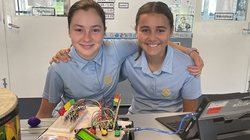 St Hilda's Year 6 students, Miette Egerton-Warburton (left) and Elizabeth Townsley (right) with "Hi LED" – a music teaching aid for the hearing-impaired