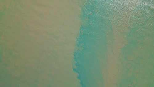 Sediment plume in Keppel Bay where water from the Fitzroy River mixes with sea water. 