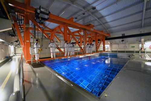 IAEA nuclear safeguard inspectors during a spent fuel training exercise. The camera-like devices are what inspectors currently use to analyse spent fuel pools.