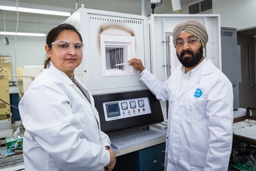 CSIRO scientists Gurpreet Kaur and Sarb Giddey with a high temperature furnace for sintering the tubes.