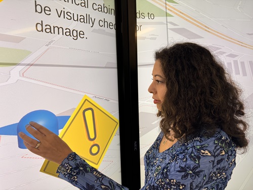 Dr Mashhuda Glencross from the University of Queensland interacting with a prototype of a virtual control room screen for the identification of hazards.