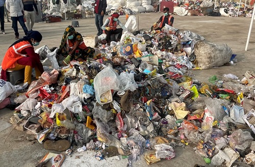 Indian workers sorting plastic waste.