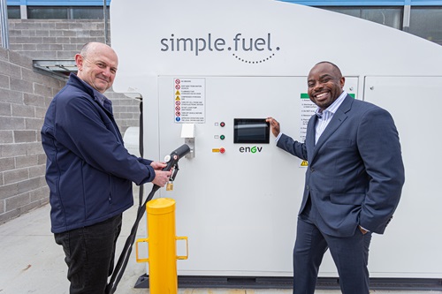 Patrick Hartley holding bowser nozzle with Gordon Chakaodza.