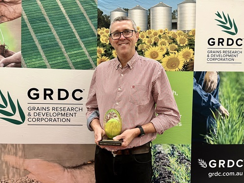 Greg Rebetzke with his GRDC Seed of Light award. Image credit: GRDC