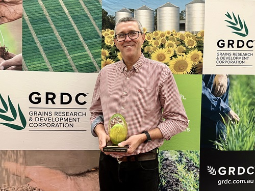 Greg Rebetzke with his GRDC Seed of Light award. Image credit: GRDC