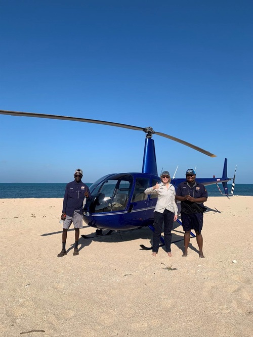 Garngi Rangers and Traditional Owners Charlie Wadaga and Eslyn Wauchope (holding the tag) with Julia Constance on the remote beach of Mc Cluer Island.