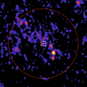 The team identified a new radio source (white square) in the centre of the cluster (red circle).