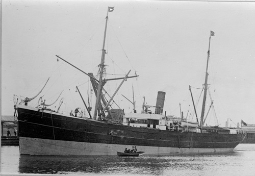 A historical black and white image of a steamship.
