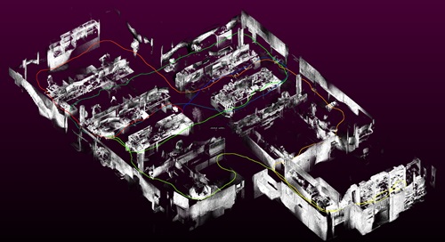 A 3D model of a CSIRO office, with desks and walls shown in grey. Coloured lines show the device's trajectory through the office space. This data was captured with Wildcat Simultaneous Localisation and Mapping onboard the multi-resolution scanning payload. 