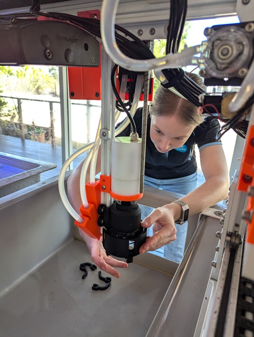 Sarah Baldwin, a Mechatronics Engineer who conducted this research while at CSIRO, fitting the hand to CHARM.  