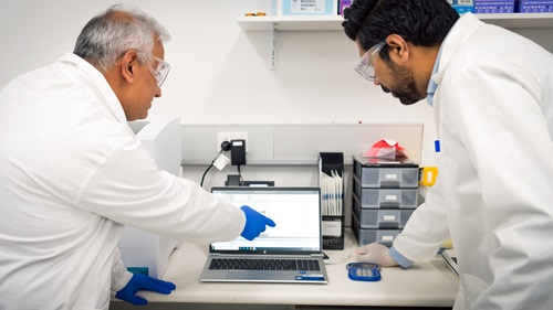 CSIRO researchers Gunjan Pandey and Rahul Rane reviewing data.