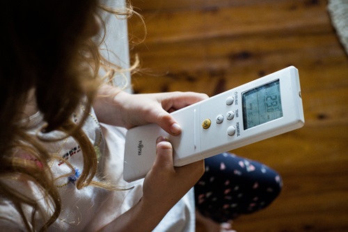 Child operating air conditioning remote