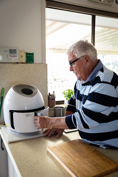 Man using air fryer