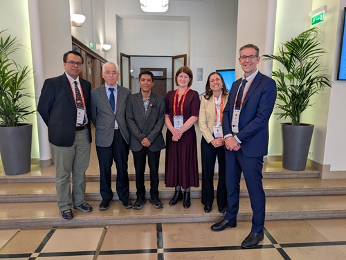 Six people standing in a row, acknowledging the endorsement of the Australia-Indonesia collaboration. 
