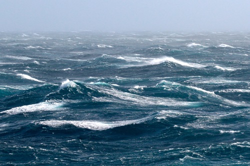Rough seas with frothy waves.