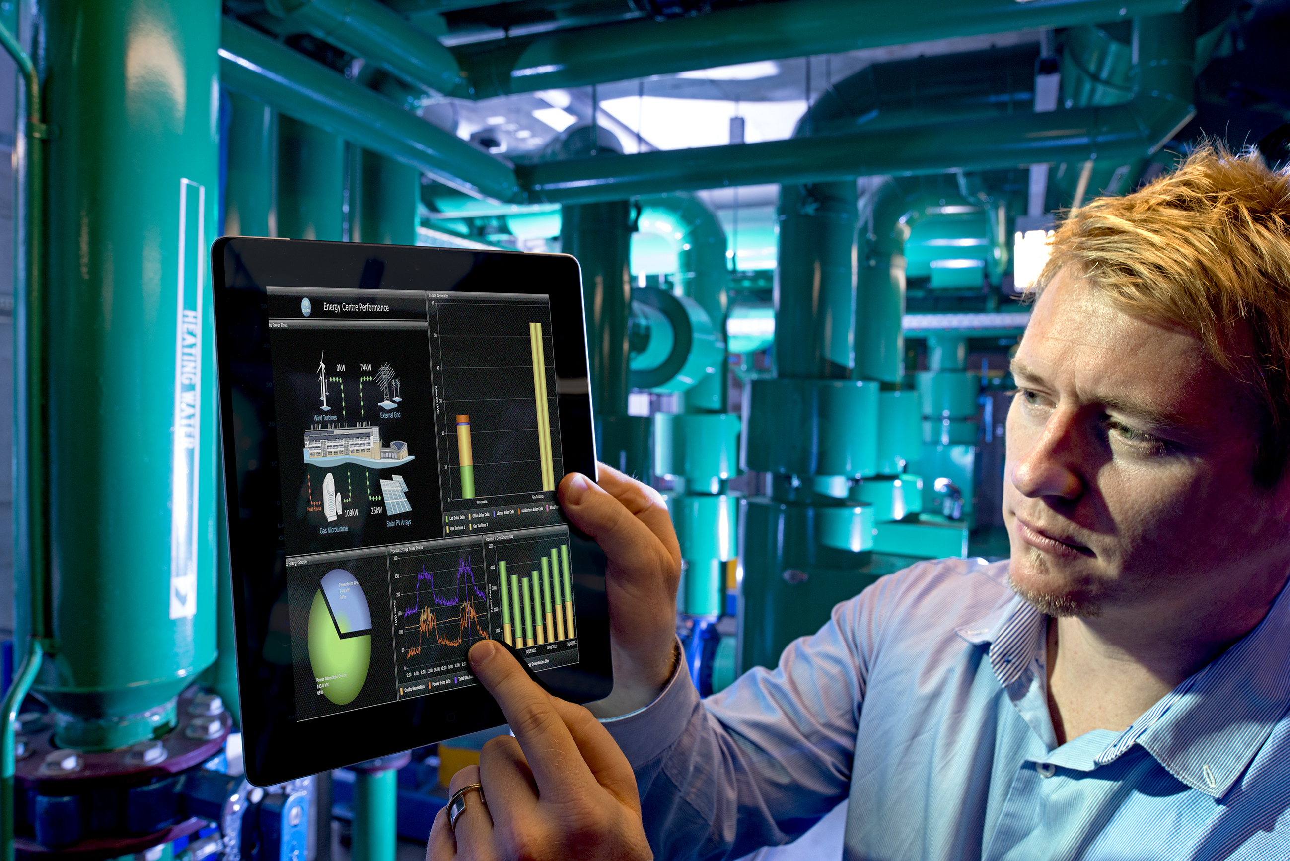 Person holding and pointing at data visualisation on an tablet.