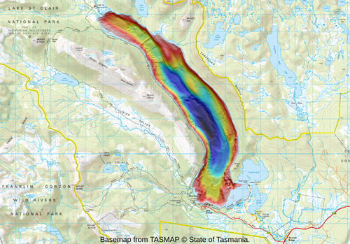 A topographical map showing natural and manmade landscape features with a lake shown in bright colours that represent different depths.