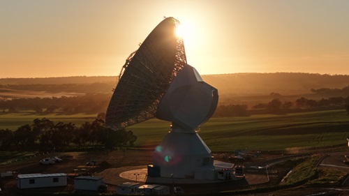 ESA's New Norcia ground station in Western Australia, a large antenna with the sunset in the background. 