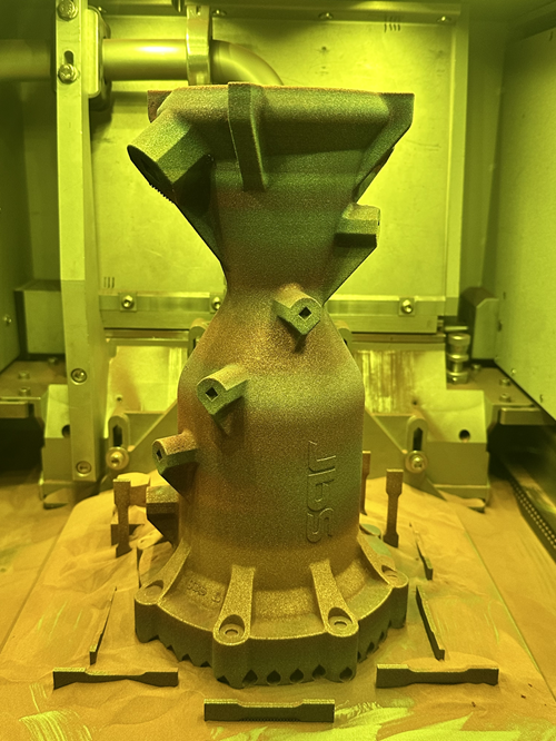 As built combustion chamber inside the processing chamber of the 3D printer.