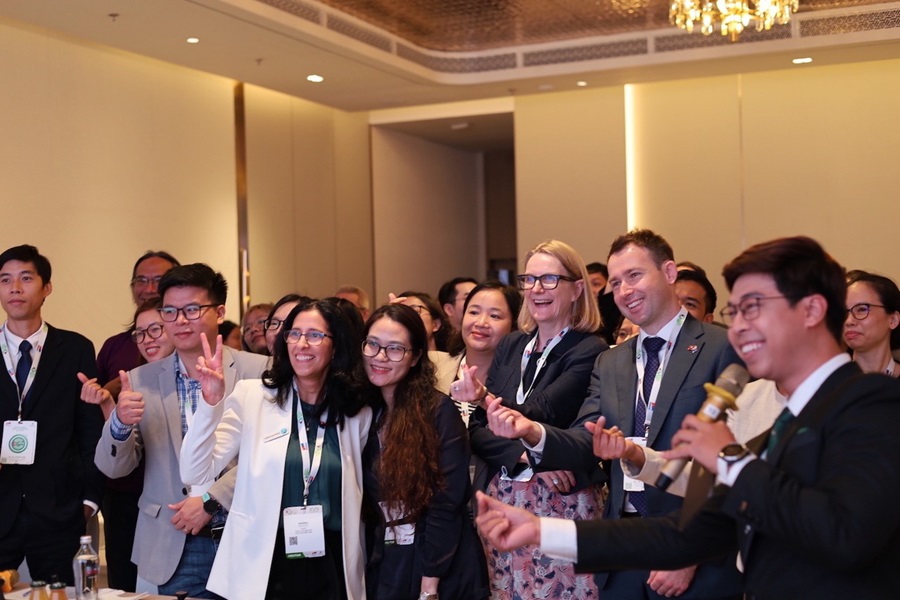 Group photo of people shown standing together at a showcase event.