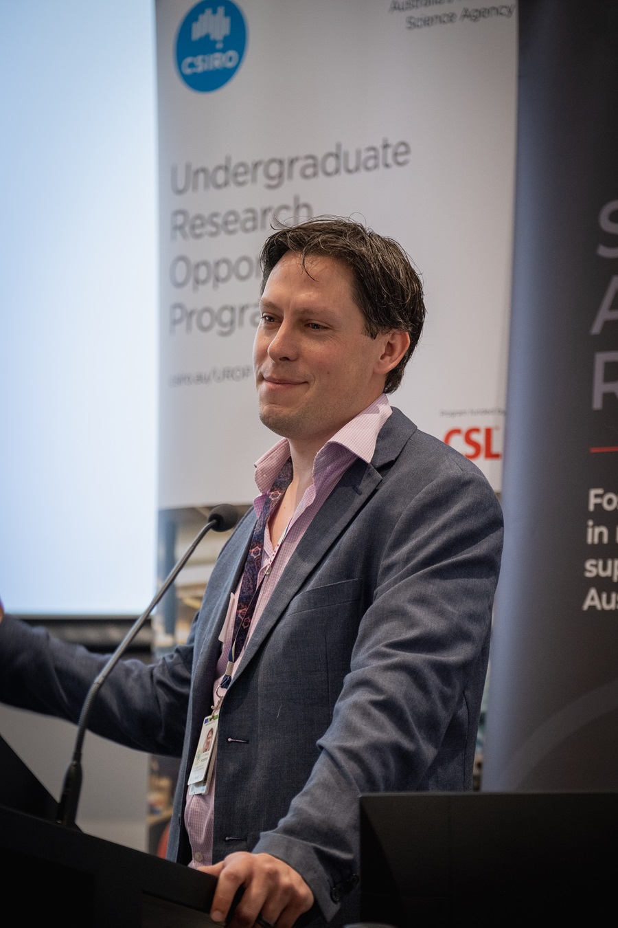 Man standing at lectern.