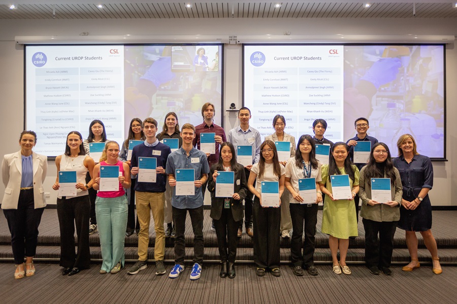 A group of students standing with certificates.