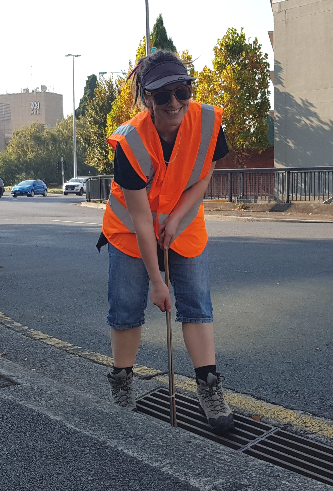 Justine Barrett inspecting storm water drain