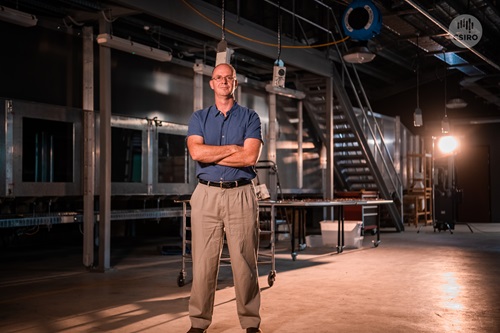 CSIRO Research Team Leader for Bushfire Behaviour and Risks Dr Andrew Sullivan standing in front of the Pyrotron at the National Bushfire Behaviour Research Laboratory at CSIRO Black Mountain, Canberra