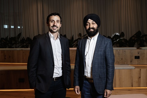 A CEO and a scientist smile for the camera