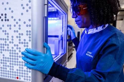 Scientist looks into a glass screen