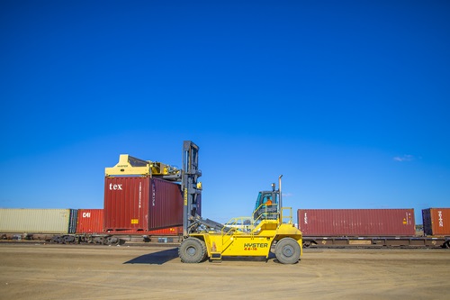 A truck loading cargo onto trains at Narrabri Freight Hub.  Image courtesy of Department of Infrastructure, Transport, Regional Development and Communications. 