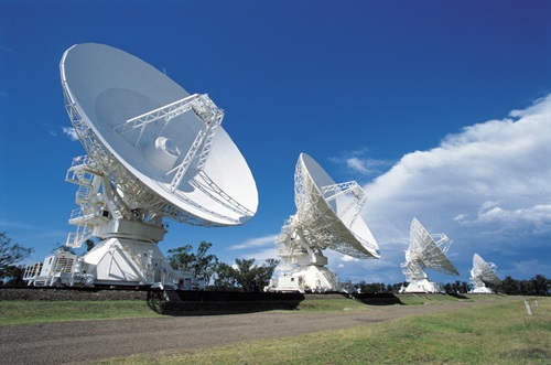 Four telescopes stand in a field