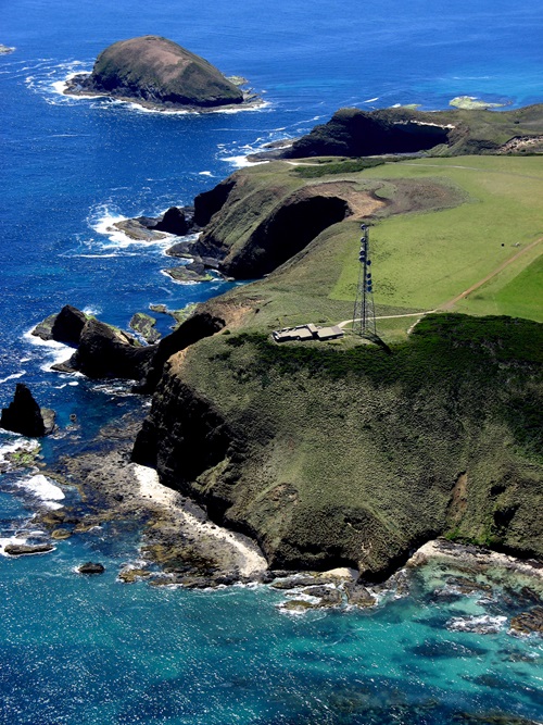 Aerial photo of a tower on a cliff