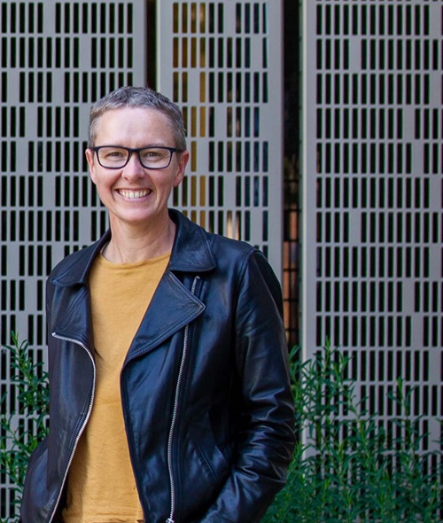 Scientist in yellow shirt and leather jacket