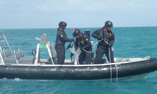 Border Force deploying hydrophone technology from a boat. 