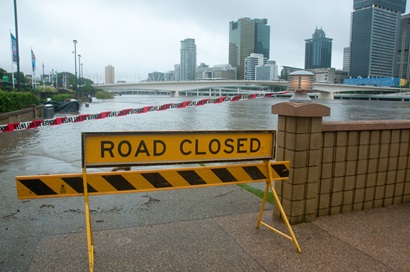 Road closed sign on walkway during Brisbane River flood