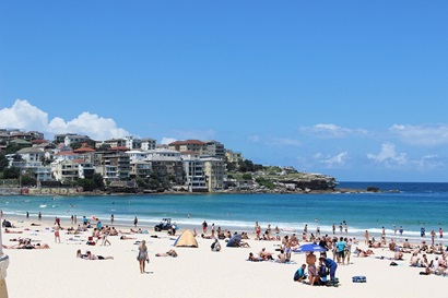 Bondi Beach featuring the ocean and people at the beach on the sand