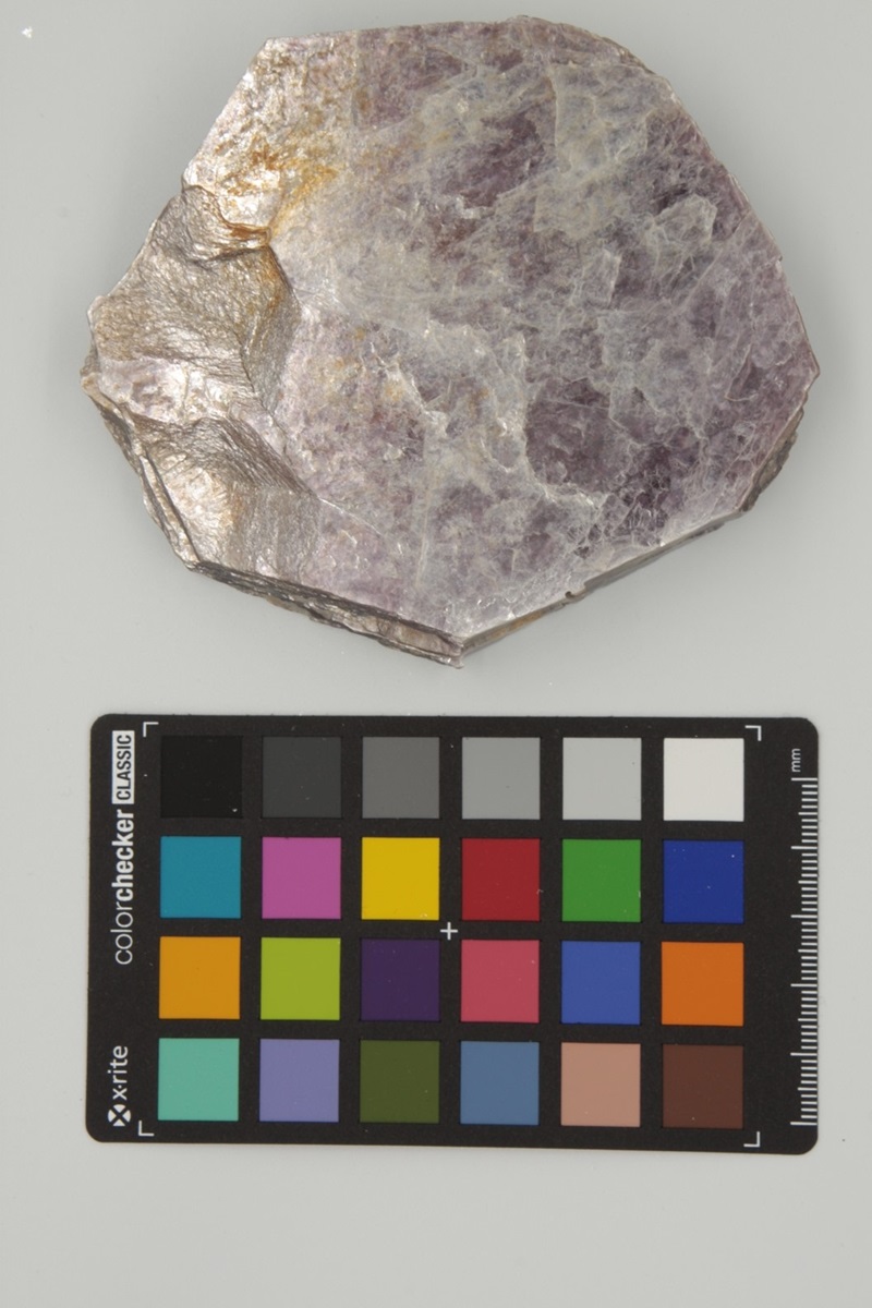 Pale purple rock with a colour chart below