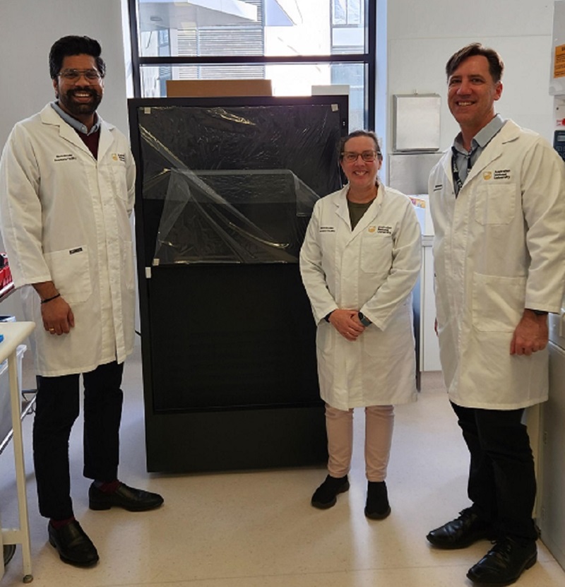 New Revio long-read sequencer machine with scientists standing on either side in a laboratory