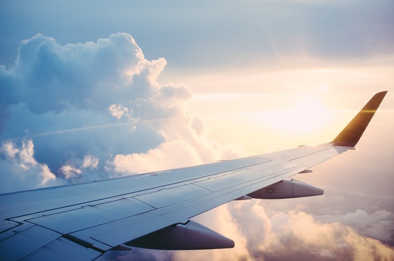 Plane wing on a clear sky.