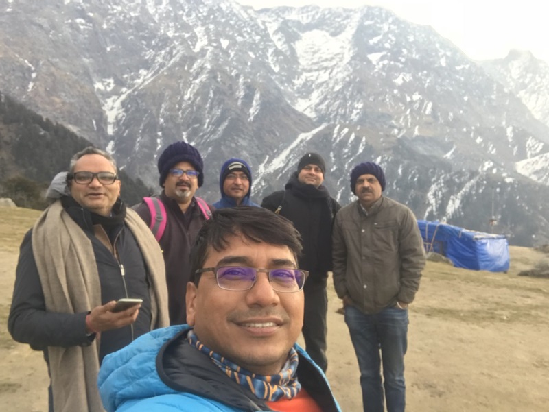 Dr Jai Vaze hiking with friends in the Himalayas, India in 2019. A Himalayan Mountain is pictured in the background.