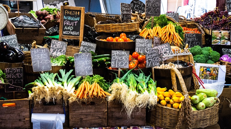 Wooden boxes and baskets of vegetables for sale at a market