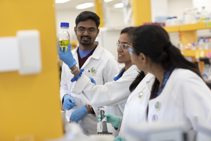 Three scientists in a lab