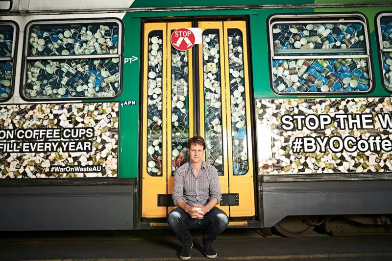  Craig Reucassel with a Melbourne tram filled with 50,000 disposable coffee cups