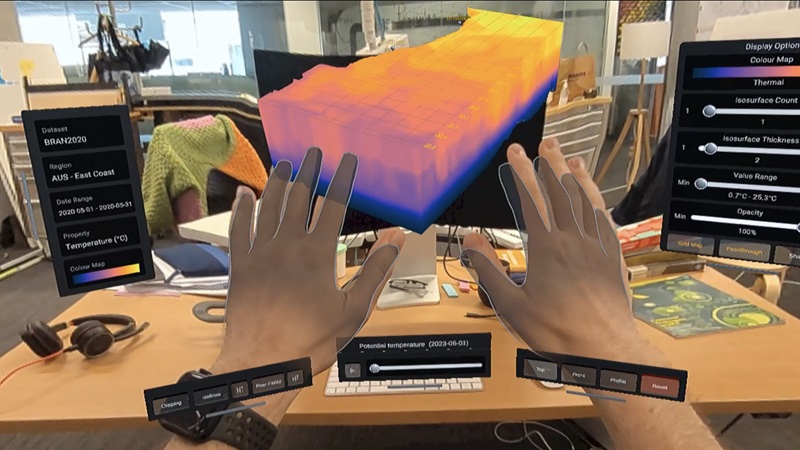 Augmented reality user interface of Ocean Explorer depicting two hands in front of the ocean volume 